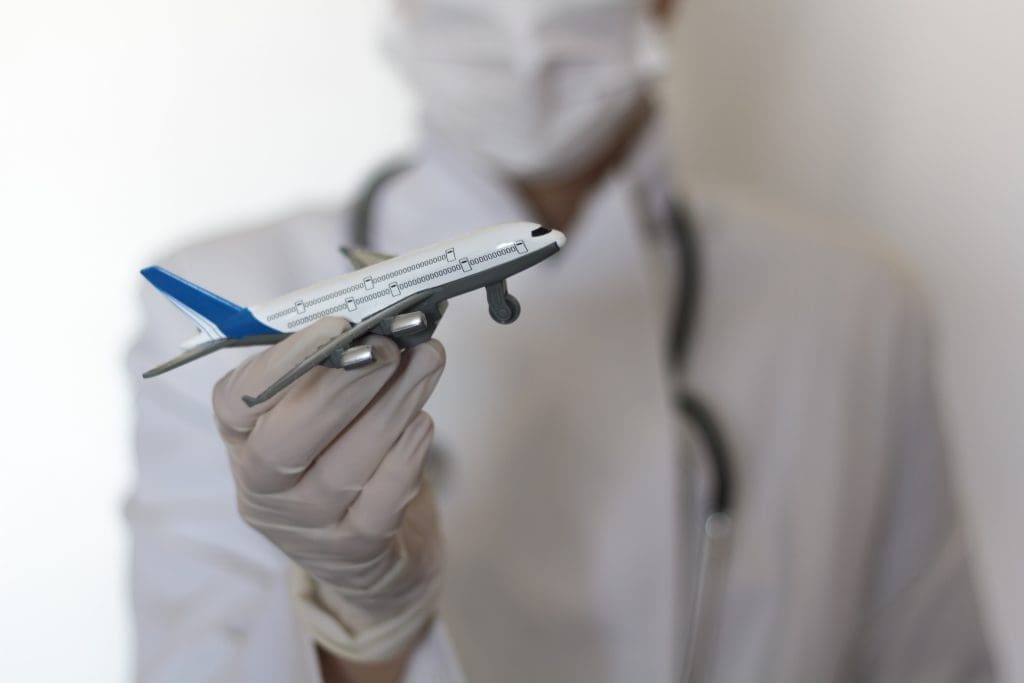 close up hand holding toy airplane LIV Hospital