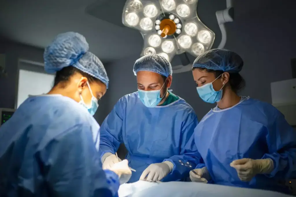A detailed surgical scene showcasing a delicate heart valve procedure. In the foreground, a team of skilled surgeons meticulously operate, their hands wielding precision instruments against the backdrop of an exposed, beating heart. The middle ground reveals the intricate anatomy of the valve, its intricate leaflets and chambers illuminated by bright, focused surgical lighting. In the background, a crisp, clean medical environment sets the stage, with state-of-the-art equipment and monitors displaying vital statistics. The overall atmosphere conveys a sense of professionalism, technical expertise, and the gravity of the life-saving procedure unfolding before the viewer. A detailed surgical scene showcasing a delicate heart valve procedure. In the foreground, a team of skilled surgeons meticulously operate, their hands wielding precision instruments against the backdrop of an exposed, beating heart. The middle ground reveals the intricate anatomy of the valve, its intricate leaflets and chambers illuminated by bright, focused surgical lighting. In the background, a crisp, clean medical environment sets the stage, with state-of-the-art equipment and monitors displaying vital statistics. The overall atmosphere conveys a sense of professionalism, technical expertise, and the gravity of the life-saving procedure unfolding before the viewer.