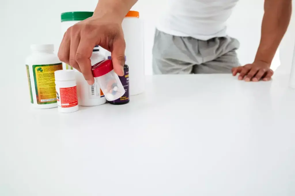 A direct side-by-side comparison of the Tylenol and Tylenol Arthritis medication bottles, captured in a well-lit studio setup. The bottles are placed on a clean, reflective surface, allowing the distinct differences in their labels, shapes, and sizes to be clearly visible. The image has a crisp, high-resolution quality, with a neutral, professional tone that is suitable for use in a medical or educational context. The lighting is soft and evenly distributed, creating subtle shadows and highlights that enhance the visual contrast between the two products. The perspective is slightly elevated, giving the viewer a clear, unobstructed view of the items.