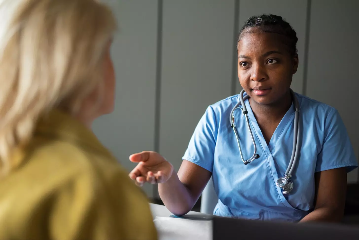 A doctor talking to a patient
