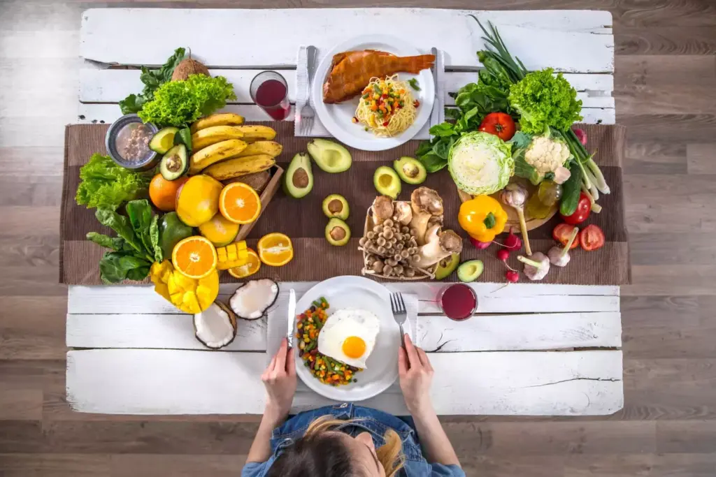 A nourishing table setting featuring a balanced spread of whole foods suitable for a post-prostatectomy diet. In the foreground, a plate showcases a variety of nutrient-dense ingredients like leafy greens, vibrant vegetables, lean protein, and whole grains. In the middle ground, a glass of water and fresh fruit accent the scene. The background depicts a warm, inviting kitchen environment with natural lighting filtering through a window, casting a soft, comforting glow. The overall atmosphere conveys a sense of wellness, healing, and the importance of mindful nutrition during prostate cancer recovery. A nourishing table setting featuring a balanced spread of whole foods suitable for a post-prostatectomy diet. In the foreground, a plate showcases a variety of nutrient-dense ingredients like leafy greens, vibrant vegetables, lean protein, and whole grains. In the middle ground, a glass of water and fresh fruit accent the scene. The background depicts a warm, inviting kitchen environment with natural lighting filtering through a window, casting a soft, comforting glow. The overall atmosphere conveys a sense of wellness, healing, and the importance of mindful nutrition during prostate cancer recovery.