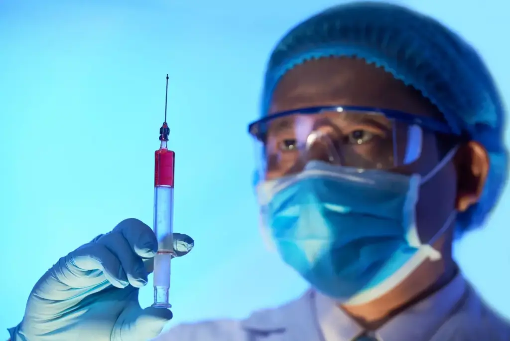 A sterile, clinical laboratory setting with modern medical equipment. In the foreground, a vial of clear liquid and syringes, representing the ABVD chemotherapy drugs. In the middle ground, a patient's arm with an intravenous line, symbolizing the administration of the treatment. The background features a medical chart or diagram illustrating the ABVD regimen and its effects on the body. Soft, neutral lighting casts a contemplative mood, emphasizing the importance and complexity of this cancer treatment. Detailed, realistic depiction using a wide-angle lens to capture the full scene.
