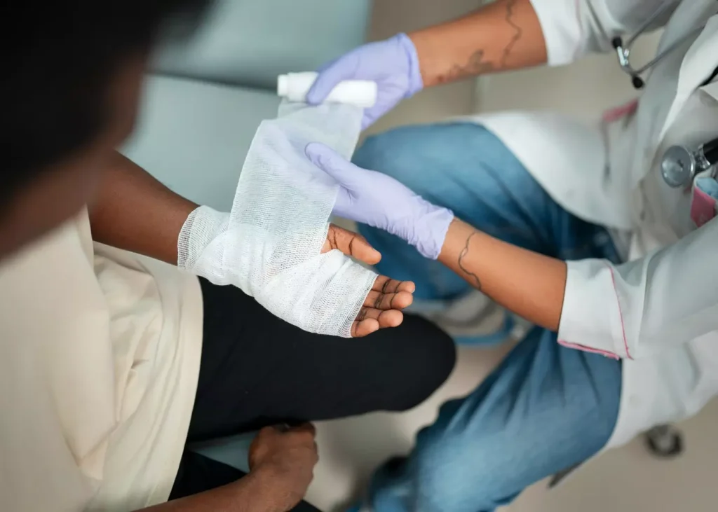 A sterile, gauze-covered dressing covering a fresh bone marrow biopsy site, with a clean, antiseptic appearance. The dressing is neatly wrapped and secured, with no visible blood or discharge. The scene is well-lit, perhaps by a soft, diffused light, creating a clinical and hygienic atmosphere. The focus is on the dressing, with the surrounding area slightly blurred to emphasize the medical nature of the subject. The image conveys a sense of care and attention to post-procedure wound management.