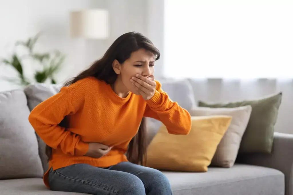 A vibrant and informative illustration depicting the two distinct phases of chemo-related nausea. In the foreground, a patient experiences acute nausea, conveyed through expressive body language and a distressed facial expression. The middle ground showcases the transition into the delayed phase, with the patient's expression shifting to a more subdued, weary state. The background features a soft, muted color palette, emphasizing the physiological changes underlying the nausea. Realistic lighting and a clean, medical aesthetic create a sense of clinical authority, guiding the viewer through the nuanced journey of chemo-induced nausea.