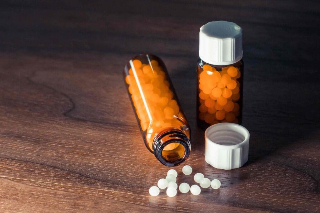 Aleve (naproxen) and Advil (ibuprofen) medication bottles Aleve (naproxen) and Advil (ibuprofen) medication bottles