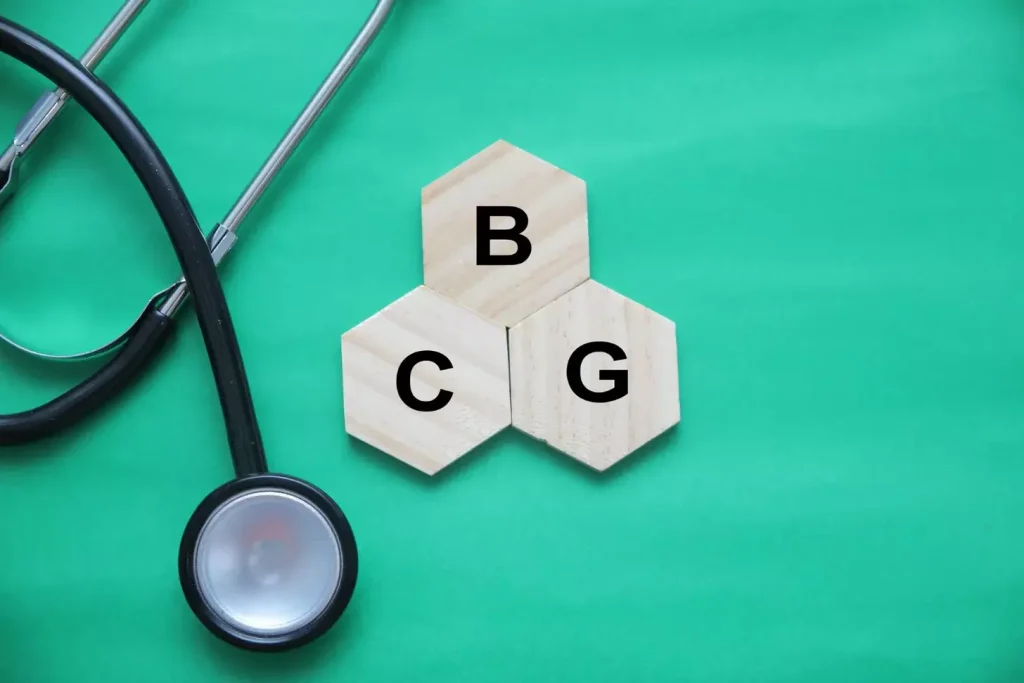 Bcg vaccine representation with stethoscope on green surface