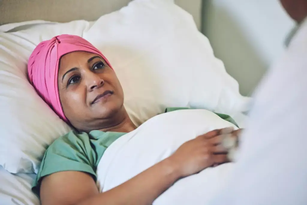 Medical healthcare and cancer with muslim woman in bed at hospital 