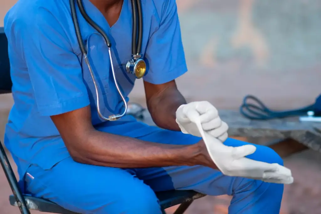 Simultaneous bilateral knee replacement surgery: A detailed medical illustration showcasing the replacement of both knees in a single procedure. The foreground depicts the surgical incisions, implanted prosthetic knee joints, and the surrounding anatomy in vivid anatomical detail. The middle ground highlights the complex instrumentation and techniques employed by the orthopedic surgeon. The background features a dimly lit operating room with specialized lighting, creating a somber, clinical atmosphere. The overall composition conveys the technical precision and gravity of this challenging double knee replacement surgery.