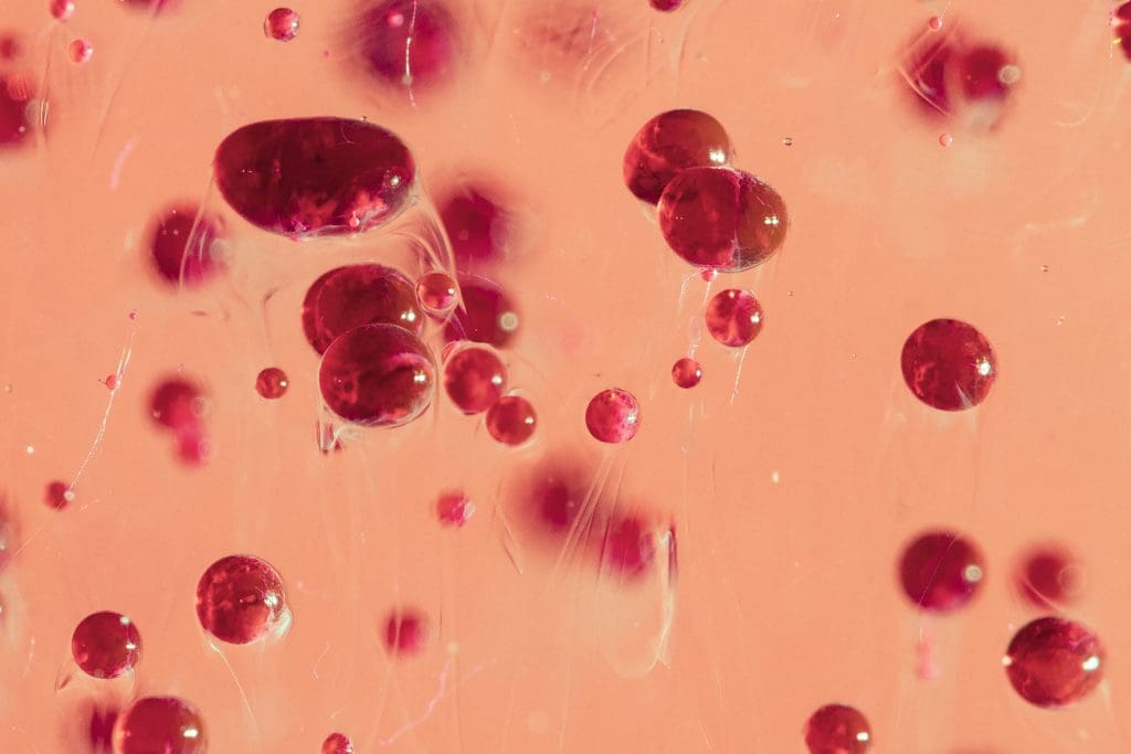 ESSENTIAL: Where Hemophiliacs Bleed 2 close up oil drops pink background 1 1 LIV Hospital
