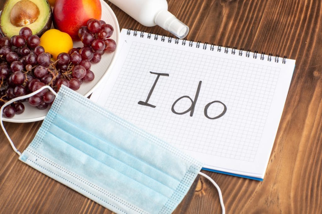 front view different fruits with notepad mask brown wooden desk LIV Hospital