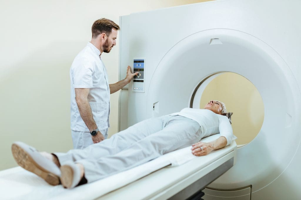 Is a Biopsy Necessary After a PET Scan? 1 medical technician mature patient mri scanning procedure clinic 3 LIV Hospital