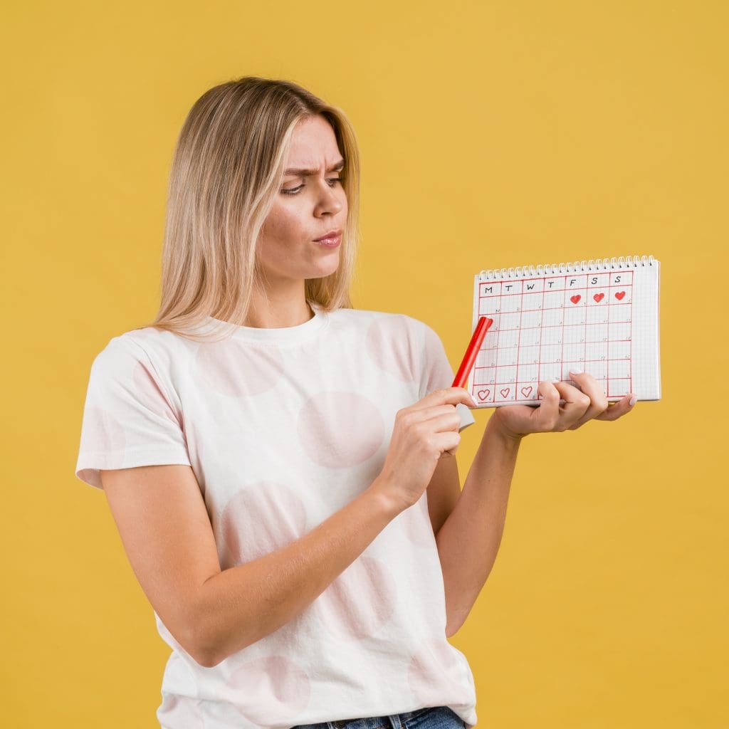 medium shot woman showing period calendar LIV Hospital