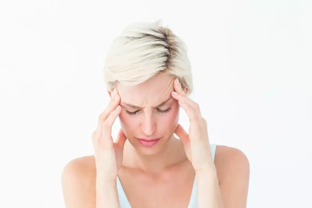 woman suffering from a headache woman suffering from a headache