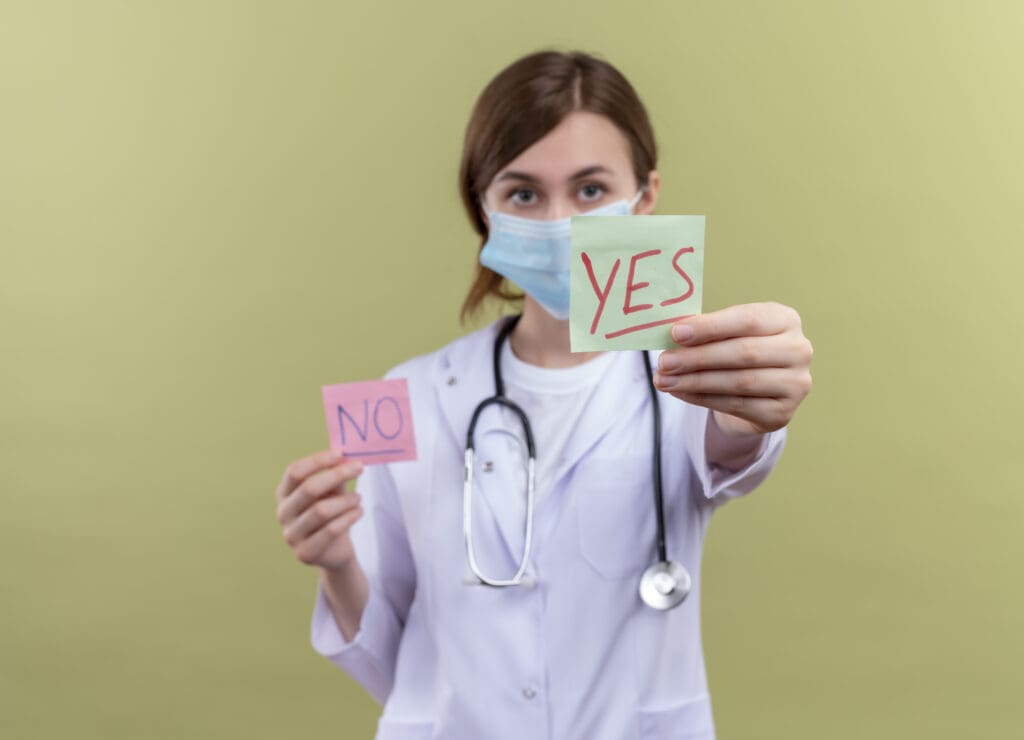 What is the new treatment for myelodysplasia? 2 young female doctor wearing medical robe mask stethoscope stretching yes note isolated green wall with copy space LIV Hospital